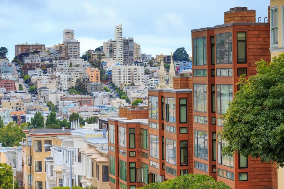 Dense multistory residential buildings in hilly San Francisco, California.